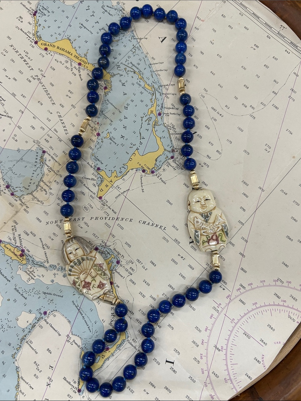 Blue Beaded Necklace with Carved Ceramic Pendants